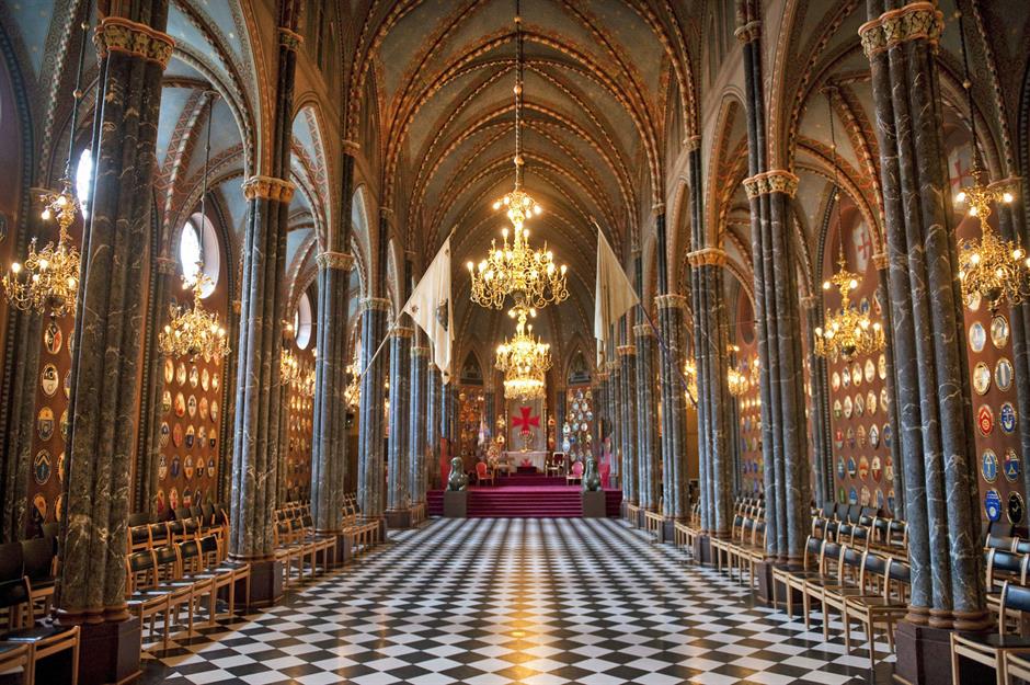 Gothic revival Masonic hall with marble columns, vaulted ceiling, and chandeliers
